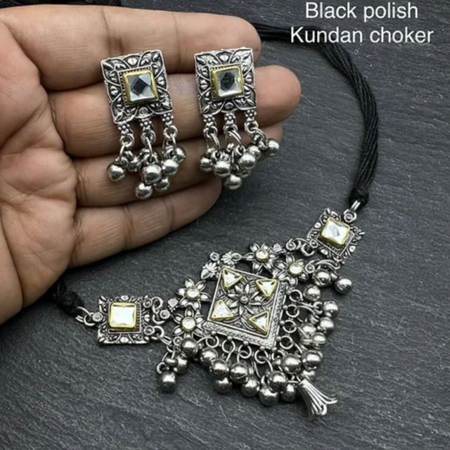 Black polish Kundan choker with golden touch